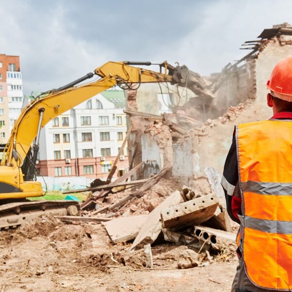 excavator crasher machine at demolition on construction site